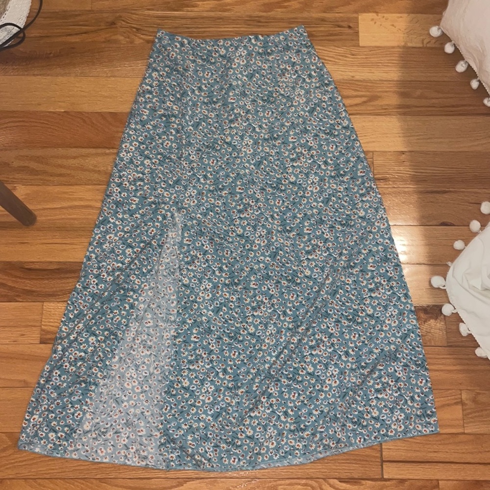 Long skirt has flowers on it